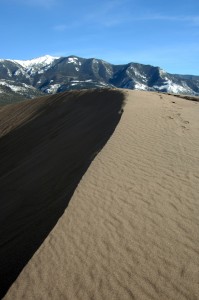 Big sand dune with dark shadow on one side